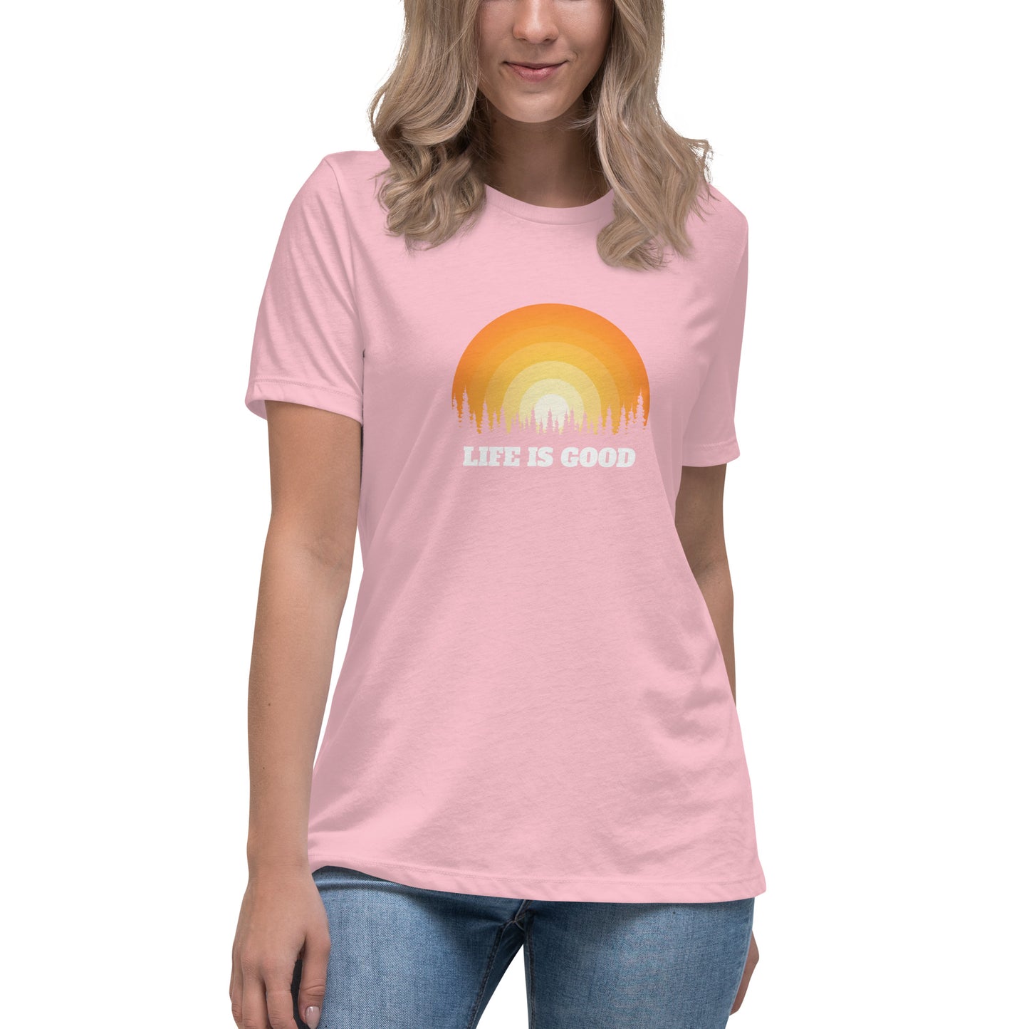 Woman in pink relaxed t-shirt with 'Life Is Good' sunset graphic