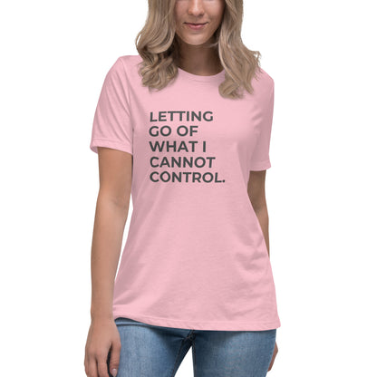 Woman wearing a pink relaxed tee with "Letting Go of What I Cannot Control" printed.