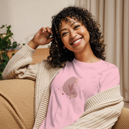 Woman wearing a pink relaxed tee with a subtle abstract floral graphic design, embodying comfortable and authentic fashion by BYOL.