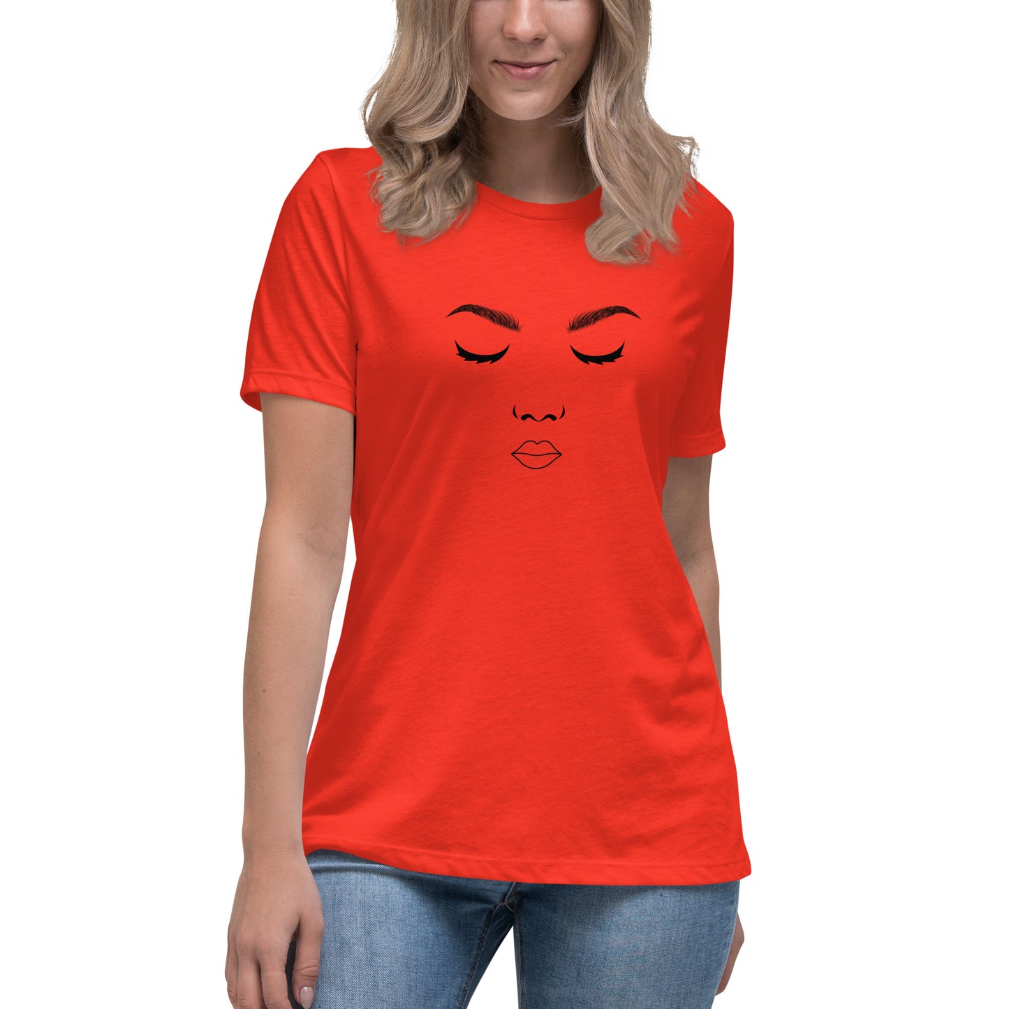 Woman wearing a poppy red relaxed t-shirt featuring a minimalist face design