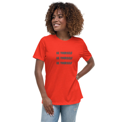 Smiling woman wearing a poppy red relaxed t-shirt with 'Be Yourself' text repeated