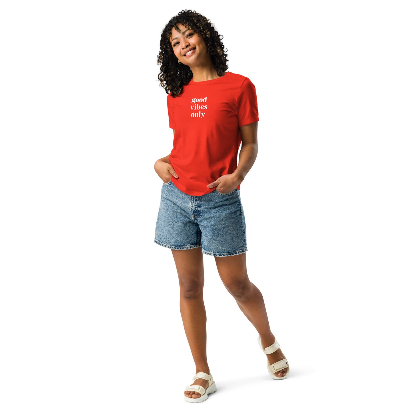 Happy woman wearing a poppy red relaxed t-shirt with 'Good Vibes Only' slogan