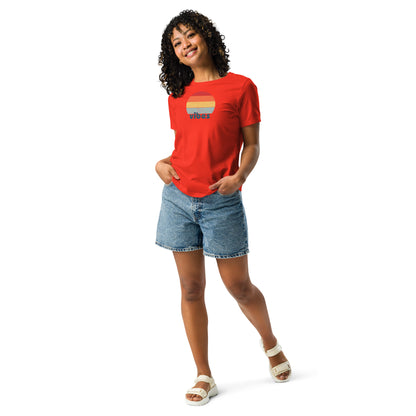 Woman wearing a poppy red relaxed t-shirt with retro 'good vibes' graphic