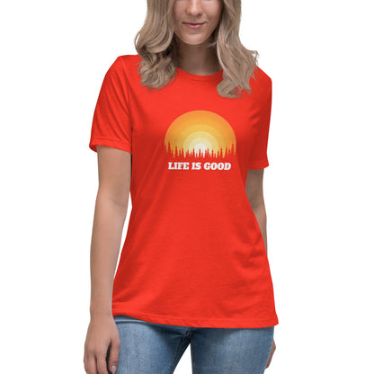 Woman in poppy red relaxed t-shirt with 'Life Is Good' sunset graphic