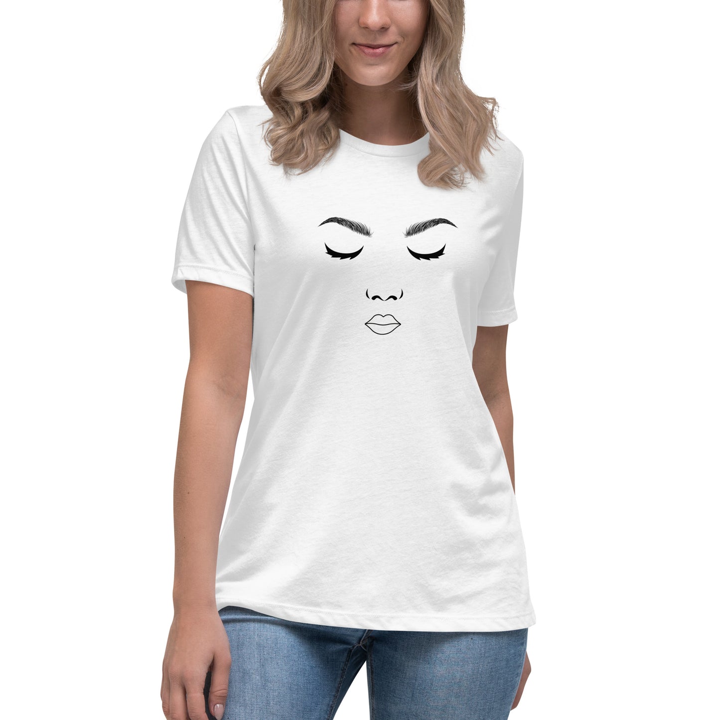 Woman wearing a white relaxed t-shirt featuring a minimalist face design