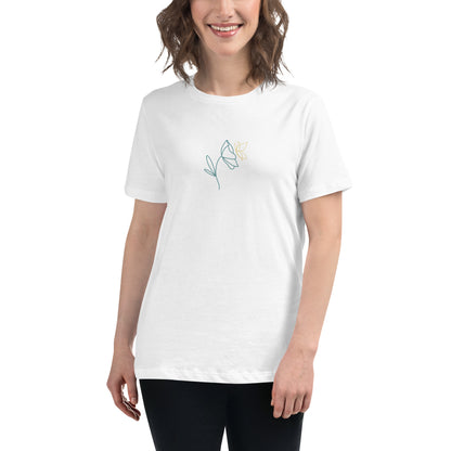 Woman wearing a white relaxed tee with a minimalist flower graphic design, embodying comfortable and authentic fashion by BYOL.