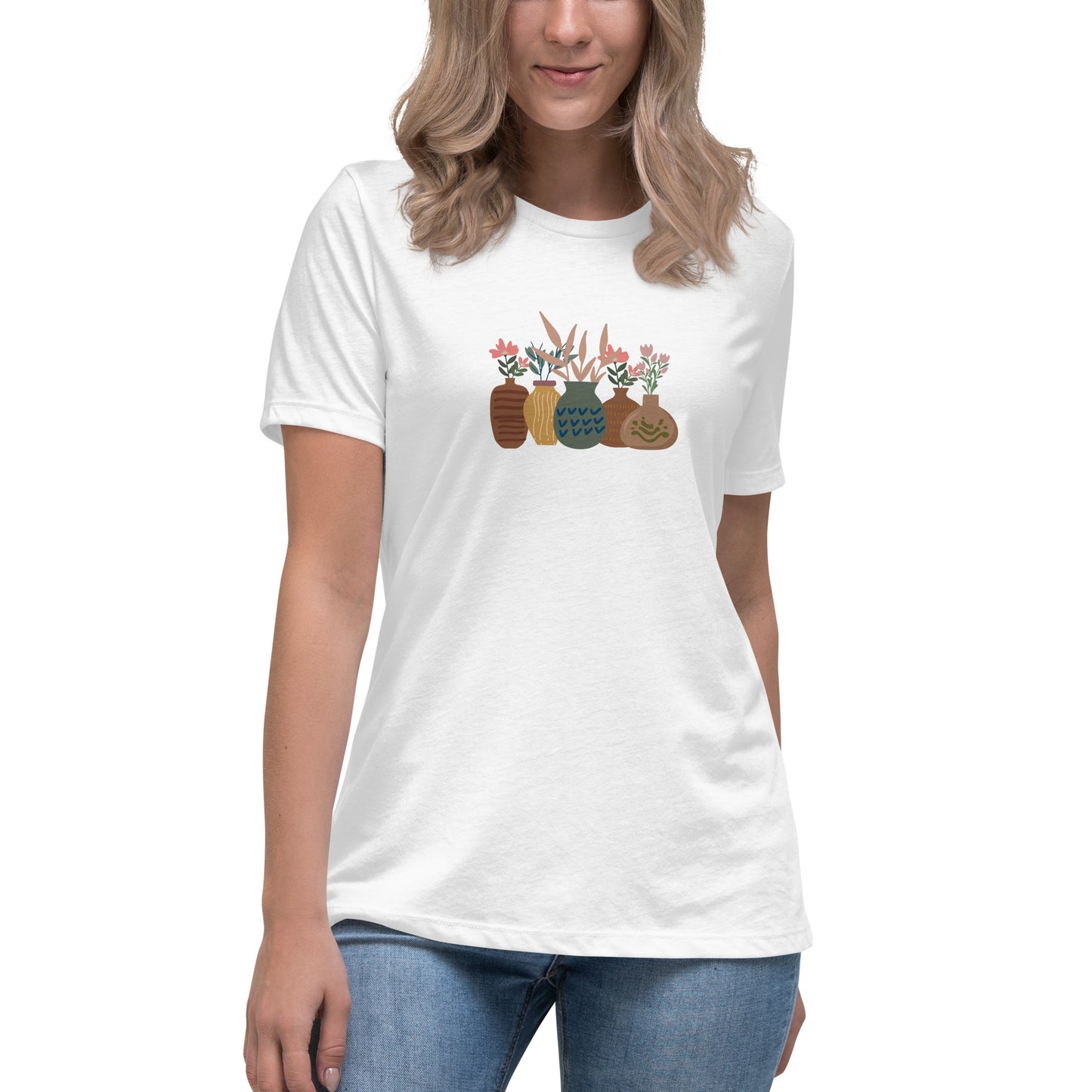 Woman wearing a white relaxed tee with a charming vase floral graphic design, embodying comfortable and authentic fashion by BYOL.