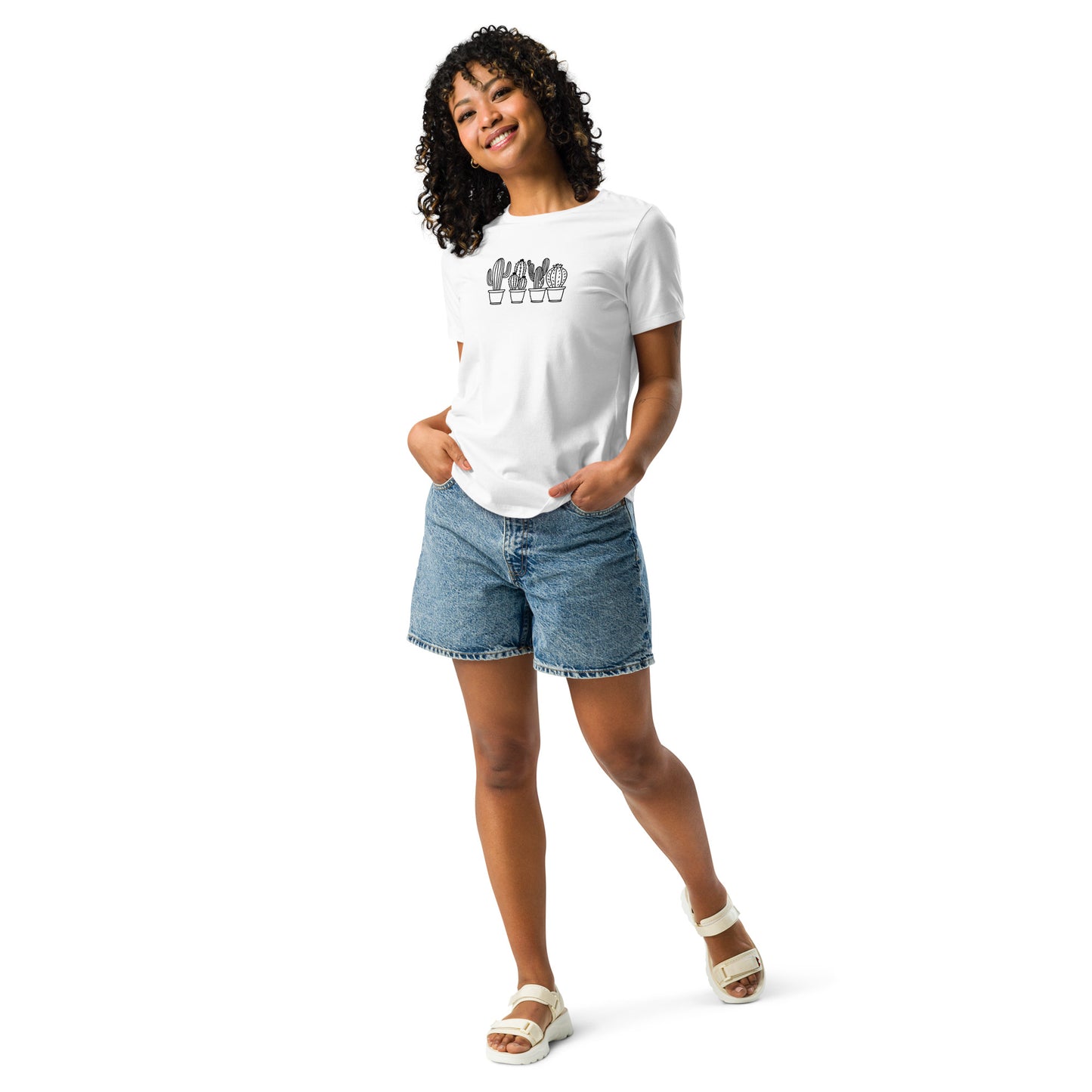 Woman wearing a white relaxed tee with a subtle cactus line art design, showcasing comfortable and authentic fashion by BYOL.